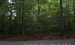 -Very nice building lot at the right price -- in desirable Woodmere subdivision. Pool and tennis can be reached out your back yard. This is a PRIME lot for building your dream home. We have builders and you can build now or later. Put this one on your