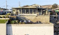 Pacific Avenue Beachfront home bottom of 16th Street life is good; Amazing sunsets,long sandy beach,and an easy stroll to town and pier. The main level features two bedroom, two baths with open kitchen; Both dining and living rooms enjoy commanding views
