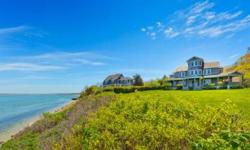 Authentic Traditional, set on under an acre of true bay frontage, high on a bluff, with expansive, lush lawn to Great Peconic Bay. With a wood shingle portecochere, wraparound porch affording magnificent 240 degree views south, north and east to Robins