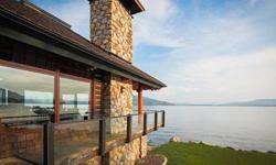 Ponder Point Extraordinaire! Designed by renowned architect, Jon Saylor. His 'Pavilion' design offers spacious yet intimate rooms which create a natural form of beauty surrounded by panoramic Lake Pend Oreille views through nearly every window. The