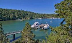 Bring the yacht...or two! This fabulous home has an equally fabulous dock. Year round protected deep water moorage is hard to find. This is a rare property inside and out. The property spans a peninsula. Watch whales & sunsets from the main house and