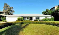 This is an amazing opportunity to live in this established, Sarasota's favorite mainland waterfront neighborhood of Harbor Acres. Located among the mega mansions, this Vintage 70's home possesses perhaps one of the most magnificent locations, resting on