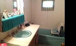 12 X 60 2-bedroom, 1-bath mobile home for sale. Partially furnished including a stack washer /dryer. It has a chain link fence Must see to appreciate the excellent condition this mobile home is in, won?t give details via the phone if you are interested