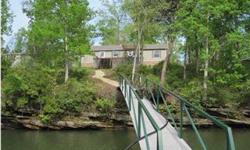Lewis Smith Lake-One level lake home on ideal lake lot! Open floor plan w/large spacious rooms. Warm up by the corner stone fireplace in the winter or enjoy the lake under the pergola on the lake side deck during the warmer season. Kit. has oak cabinets &