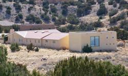 Phenomenal views from this gorgeous northern NM style home in tranquil Placitas Valley. Spectacular detached 1000 Sf art studio with loft & 3/4 bath, perfect for artist, jeweler, woodworker or craftsman-could be guest house too! Saltillo tile throughout,