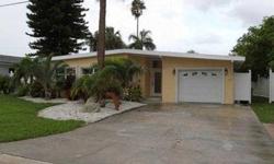Deep Salt Water Canal Home in Treasure Island, Florida! With 2 nice size bedrooms, 2 baths with 1589 sqft. Travertine Marble Flooring and Carpet.Granite countertops in Kitchen and Designer Cabintery. Covered Lanai. Dock.