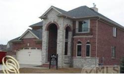 NEW CONSTRUCTION!Custom design Brick Elevation, Wine Cellar in 8'9" bsmt, 9 ft 1st flr. ceilings,Oak staircase w/ Iron spindles.1st flr Laundry rm w/built in bench seat,Travertine Kit. flrs w/Custom design 42" Maple cabinets,Walk-in pantry,Coffered