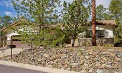 Private, peaceful, and perfect, this immaculate, single-level home is nestled into the towering cool pines in one of Prescott's finest neighborhoods. With a freshly painted neutral interior,three bedrooms and two-and-a-half baths and an additional heated