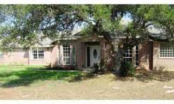 Secluded Ranch Style Home on 3.2 Acres with Loads of Trees and Circular Driveway that exits back onto Logan Ranch Rd. All Brick Exterior, Well Water! Country Living with some space yet only 2 1/2 to HEB and Shopping! Computer Niche off Utility Room.