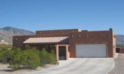 Custom Santa Fe style Home.. 4 Bedroom split floor plan, 3 full bathrooms with custom tile and glass block windows, solid surface countertops, all 18" tile throughout (except bedrooms), all 9',10', and 12' ceilings. Beautiful built in entertainment