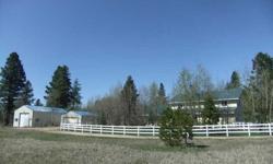 Excellent value for large 4 bedroom, 2 1/2BA country home with 3 acres in addition to oversized 2 car attached garage and 2 additional outbuildings with nearly 2000 square footage additional storage. Fenced pasture and yard. Just south of McCall on county