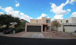 This gated four bedrooms, 2 1/two bathrooms home backs up to natural desert providing spectacular views of pusch ridge & arroyo from the flagstone patio and private master balcony. Brian Wick is showing 1719 E Deer Hollow Loop in Oro Valley which has 4