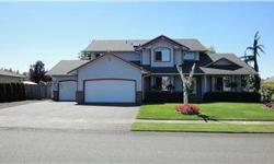 Privacy abounds in the generous and fully fenced backyard of this inviting 2-story home in the Black Hawk neighborhood in Tumwater, WA. Year-round entertaining made simple under the over-sized covered patio. The living room's wall of windows brings the