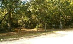 Absolutely gorgeous, completely fenced 3.45 acre property with double gate entry, 16x20 garage/workshop with roll up door and constructed of all pressure treated wood, beautiful oak trees and other pretty foliage with very nice homes all around the