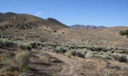 Country setting buildable land with tremendous mountain and lake views. This property is a diverse as they come. A sloping lot ~ so you could place you home up on top for a scenic view, or tuck it down below for more privacy. The surrounding mountains