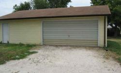 1080 Sq. Ft. garage with electric & heat could easily accomodate 4 cars. Perfect retreat for a "Man Cave". 100 amp service. Bldg 35 X 29 with vinyl siding. For more information call Sonja Shaw or Craig Baker at 1-800-377-3350 or 618-Listing originally