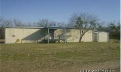 Neat mobile home on .5 ACRE fenced lot has new bedroom added. This 3 BR, 2 bath home has split BR plan. Master bedroom has new texture, paint & trim to match the other 2 BR's + master bath has 2 vanities, garden tub, separate shower & commode & large