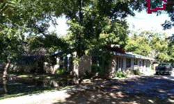 Nestled in the Pecan Trees! Large brick home on 3 acres, front courtyard with green all around! 3 bedrooms 2 bath. Formal dining area. Kitchen has eating area, electric stove, dishwasher. Fireplace in the living room, separate office space. Enclosed back