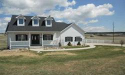 Country living at its best.Sitting on over 5 acres this home has rolling meadows and large barn ready for your horses.It is an adorable home with unfinished basement.Main level master has 5pc bathroom.Deck of back is a nice size.HOA is moving eastern
