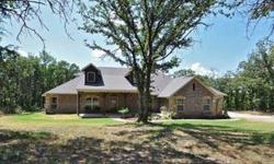 Come experience and live with nature here in this beautiful wooded 4 acre property in Edmond schools. 4 bedrooms on lower level and 1 bed w/full bath & game room up. Relax on your back patio as you watch the birds & deer in the morning or the absolute