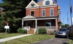 This Victorian home features Brick exterior, Composition roof, 2 car Detached Garage, Hard Wood and Ceramic Tile floors, Gas and Forced Air heating, Central Air cooling, 5 bedrooms, 3 full bathrooms, 1 partial bathroom, Automatic Garage door opener, Dish