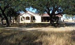 This spectacular Hill Country beauty is nestled on 13.4 acres, partially wooded, & is conveniently located on highly sought after FM 479, just 15 minutes NW of Kerrville. The 3,282 sq ft single story stone home includes 2 living areas, 2 wood-burning