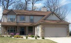 Located on a wooded corner lot is a beautiful four bedroom, three bath two story in Schererville?s Camden Woods Subdivision. Upon entering, you will immediately see a formal living room that is open to a formal dining room. Just off from the formal dining