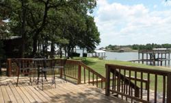 This lakefront property has a 1,172 sq. ft., 3 bed, 3 bath waterfront home, built 1998, in 2008 installed new windows for great view of the lake, new floors, new paint inside & out, added another deck, new CA/H installed in June 2011, detached carport