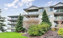 Vaulted ceilings in the penthouse unit with a private deck and westerly views of the lake, mountains and Husky Stadium. The move in ready unit has been impeccably maintained, with new appliances and flooring and includes a fireplace, A/C, in unit washer