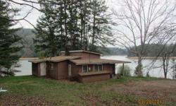 THIS HOUSE IS ON THE POINT. EXCELLENT VIEWS. APPROX 571 FEET OF LAKE FRONT. THIS HOME IS IN GOOD CONDITION FOR ITS AGE, NEEDS A/C AND OTHER UPKEEP. HOUSE TO BE SOLD "AS IS" AND THE PRICE IS FIRM. CALL REALTOR FOR ADDITIONAL INFORMATION.