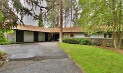 Calling all Mid-Century fans! This one owner Ellsworth Graham custom home is in stunning original condition. Tile entry leads to formal living room with marble-faced fireplace and wall of windows. Formal dining room with built-in buffet. Nostalgic kitchen