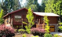 CUSTOM LOG HOME. WONDERFUL MASTER SUITE - PARKLIKE SETTING. OPEN BEAM CEILINGS & FULL LOG EXPOSED WALLS-RUSTIC LOOK W/DESIGNER CHARM.POSSIBLE SEPARATE LIVING W/BATH,BDRM,WET BAR & FAMILY ROOM DOWNSTAIRS,WOODSTOVE PAD AND ITS OWN ENTRANCE!LARGE SHOP W/HALF