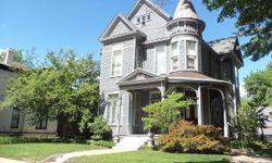 Spectacular 1879 Victorian home with all the grandeur you would expect, high ceilings, tall doors, beautiful wood flooring with stunning intricate inlaid design around the edges, numerous entries, wide baseboards, picture hanging moldings, built ins, wide