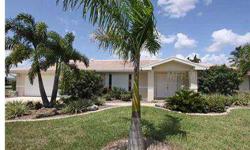 PUNTA GORDA ISLES - IMMACULATE 1871 SF 3 BD/2BA/2 CAR GARAGE POOL HOME W/AN INCREDIBLE LIST OF UPDATES and EXTRAS, AN OUTSTANDING OVERSIZED LOT WITH 95FT ON THE CANAL, AND QUICK BOATING ACCESS TO CHARLOTTE HARBOR IN LESS THAN 15 MIN. You'll love the exce