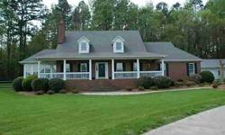 Reduced $80K! Fantastic sprawling 4 BR home on 2 acres. Rocking chair front porch! Hardwoods throughout main level. 2 story Great Room w/floor to ceiling masonry fp which sees-thru to the sunroom. Updated kit and baths! Bright open Kitchen w/new granite