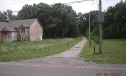 12 acres perfect for scenic wooded homesite or has great development potential. Backs large government owned outlot. 2,016 sq ft 2 Story home on property currently rents for $1,275/month ($675 upper level/$600 lower level). Also, 30x72 pole barn on
