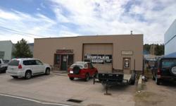Great location with access from two streets. Main Garage has two tall bay doors could be opened to make large drive through space. Store with showroom, large office and back stock room with small bay perfect for deliveries. Building could be made into 4