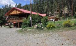 Wonderful Twisp River Log Home - 3 bedroom 2 bath home situated on 1.23 acre lot backing to forest service land. Wonderful sunny location with great views. Large detached 2 car garage with attached office. Large insulated and heated shop and additional