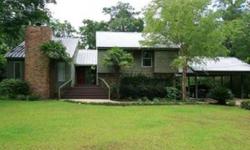 Wonderful home with deeded bay access to Mobile Bay. Spacious floor plan in this tri-level home. Lush landscaping, fenced and separate fence around the pool, metal roof, new windows about 6 years old. Fresh paint and carpet in living room. A lot of house