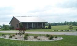53.9 Acres w/3600 Sq. Ft. Brick Home, beautiful landscaping, 2 stamped concrete porches and walks, 30x40 metal building w/shed, concrete, kitchen, half bath combination. Barn w/pastureland and cattle waterer. 16 acres in crop w/Income of $3600 annual pay.