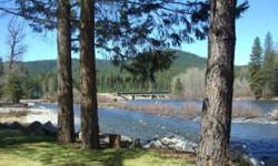 Looking for a turn key getaway set a stone's throw from the river's edge in Plain? Take a peak at this compact cabin set on a park-like, level lot on the Wentachee River. Knotty pine paneling, wonderful picture windows overlooking the river, a nicely