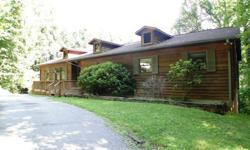 Spacious 5 bedroom / 3 bath cedar-sided and brick home, with a 1 bedroom / 1 bath cabin on 10.89 Acres +/- in Franklin NC ! This is a lovely residence with total privacy yet not remote... tremendous winter view that could be full time with tree trimming.