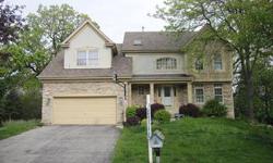 Three bedroom home in Fox River Grove with three and a half baths. Big living room with walls of windows and one of two fireplaces. The kitchen has an island for extra workspace and two walls of cabinetry. Separate dining room. The master bedroom has a