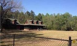 Log Cabin W/140 Acres - Outdoor Enthusiasts Dream Home. Home & 2 Acres Fully Enclosed With Chainlink Fence. Full Front Porch W/Ceiling Fans. Rear Patio. Home Total Electric; Heart Of Pine Floors Throughout; Family Room W/Wood Burning Fireplace; Dining