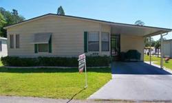 A furnished 2br/2ba home that is bright and cheery. This is a 1988 Palm Harbor home with 1144sf of living space plus a screened FLR on the back of the home with tile flooring. There is an oversized LR with bay windows and a formal DR with laminate floors