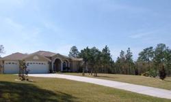 LOCATED ON AN ELEVATED 31500SQ FT GOLF COURSE LOT. *THE 3 CAR GARAGE WAS EXTENDED 2 FEET WHEN BEING BUILT. *THE GRECIAN POOL WITH ARCHES IS 30'X14'WITH A BRICK PAVED DECK AND LANAI. THERE IS A POOL STORE FOR RQUIPMENT. *THE 52YARD DRIVEWAY AND ALL