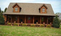 Meticulously Maintained Log Home on 4.38 Acre lot with 32x40 Detached Garage & Rocking Chair Front Porch. Granite Kitchen/SS Appliances/Ceramic Tile & French Doors That Open to Rear Deck.Soaring 1.5 Story Great Room with fans and view of acerage.Master