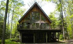 THE PERFECT LAKE GETAWAY CHALET. LOTS OF WOOD AND GLASS, CONVENIENTLY LOCATED TO ALL AREA ACTIVITIES YET TUCKED AWAY IN A PRIVATE, WOODED SETTING. LARGE LOFT AREA FOR ADDITIONAL SLEEPING SPACE OR FAMILY ROOM. INCLUDES 53' SPLIT LAKEFRONT PARCEL WITH TYPE