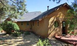 Beautiful Adobe passive solar straw bale home on quiet Trappers Crossing road with peek a boo views of the new Lake Nighthorse reservoir. Great valleyviews from the big deck off the living room. The property consists of 10 wooded and private acres