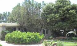 Owner financing available. Unique, rare, hard to find. Classic Mossman gem. Centrally located on oversized lot. 3000 sq. ft. 1/3 acre. Golf course, open space, Sandia views. Hardwood, vaulted ceiling, flagstone patio, wool carpet, porcelain tile. Sunroom,